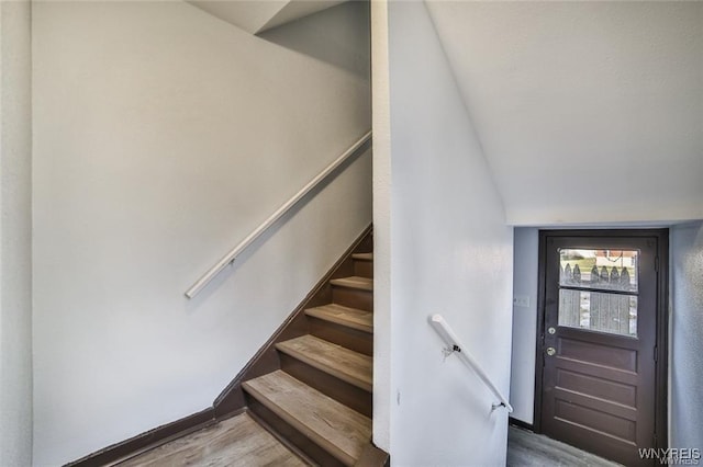 417 24th St, Niagara Falls, NY 14303 - staircase with wood finished floors and vaulted ceiling