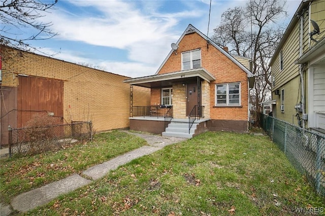 417 24th St, Niagara Falls, NY 14303 - view of front facade featuring brick siding and covered porch