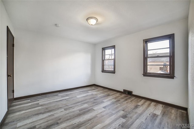 417 24th St, Niagara Falls, NY 14303 - unfurnished room featuring wood finished floors and baseboards