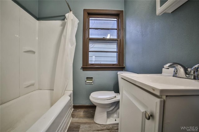 417 24th St, Niagara Falls, NY 14303 - bathroom featuring wood finished floors, toilet, baseboards, vanity, and a textured wall