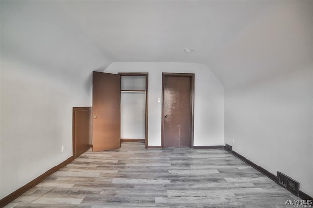 417 24th St, Niagara Falls, NY 14303 - bonus room with lofted ceiling, wood finished floors, and baseboards