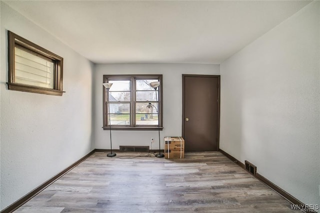 417 24th St, Niagara Falls, NY 14303 - spare room featuring wood finished floors and baseboards