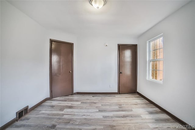 417 24th St, Niagara Falls, NY 14303 - spare room featuring light wood finished floors and baseboards