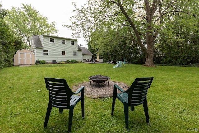 114 Osborne Dr, Manlius, NY 13057 - view of green lawn with an outdoor fire pit