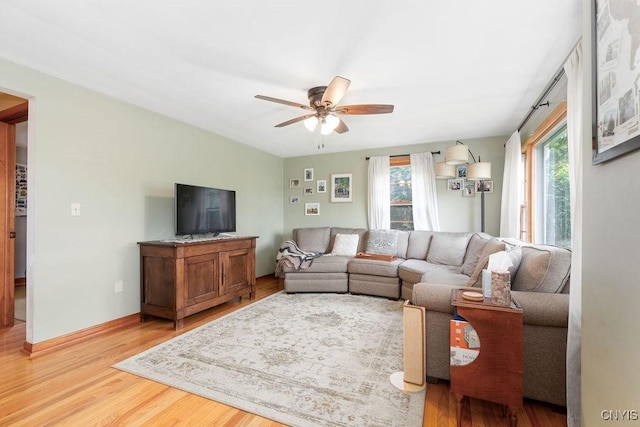114 Osborne Dr, Manlius, NY 13057 - living room with a ceiling fan and light wood-style floors