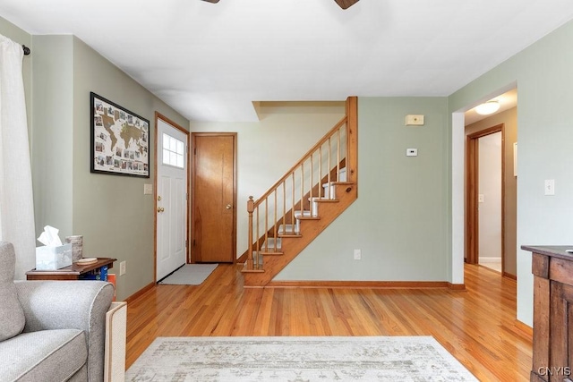 114 Osborne Dr, Manlius, NY 13057 - foyer featuring wood finished floors, stairs, baseboards, and ceiling fan