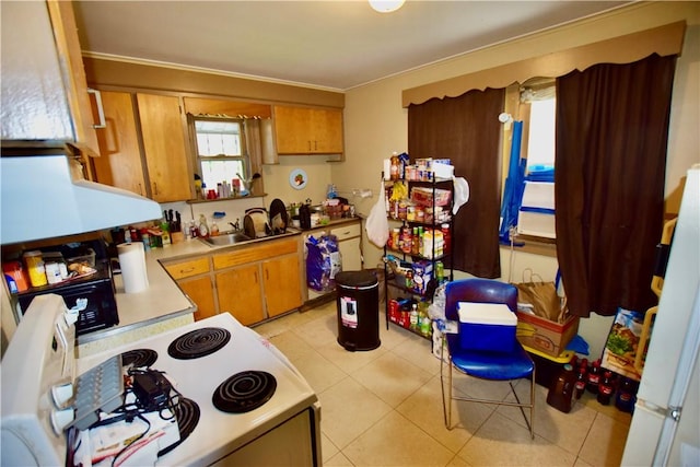 131 Weaver St, Rochester, NY 14621 - kitchen featuring white electric range, a sink, light countertops, brown cabinetry, and light tile patterned floors