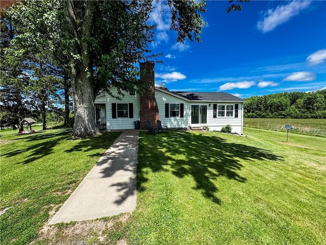 6794 Fosterville Rd, Aurelius, NY 13021 - view of front facade with a chimney, a front yard, and entry steps