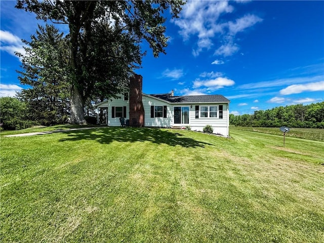 6794 Fosterville Rd, Aurelius, NY 13021 - ranch-style house with a front lawn and a chimney