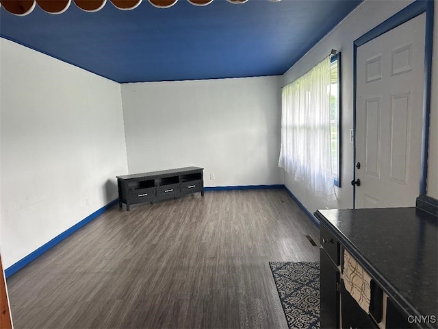 442 Euclid Rd, Utica, NY 13502 - unfurnished living room with wood finished floors and baseboards