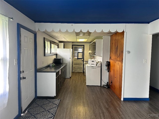 442 Euclid Rd, Utica, NY 13502 - kitchen with dark wood-style flooring, range, freestanding refrigerator, black microwave, and dark countertops