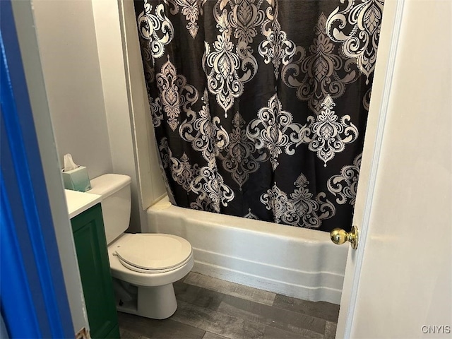 442 Euclid Rd, Utica, NY 13502 - bathroom with shower / bath combo with shower curtain, vanity, toilet, and wood finished floors