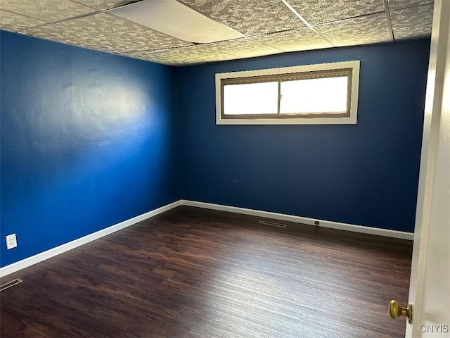 442 Euclid Rd, Utica, NY 13502 - empty room with a paneled ceiling, wood finished floors, and baseboards