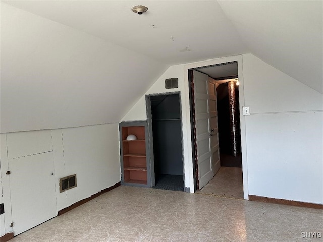 442 Euclid Rd, Utica, NY 13502 - bonus room featuring lofted ceiling, tile patterned floors, and baseboards