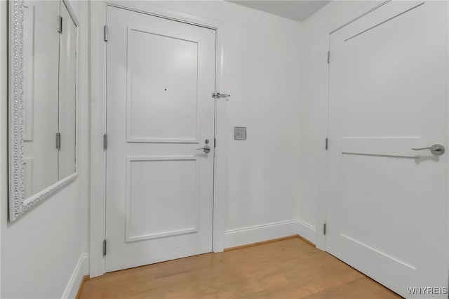 132 Lakefront Blvd Unit 403, Buffalo, NY 14202 - doorway to outside with light wood-type flooring and baseboards