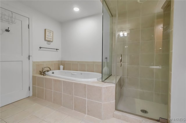 132 Lakefront Blvd Unit 403, Buffalo, NY 14202 - bathroom with a bath, a shower stall, and tile patterned floors