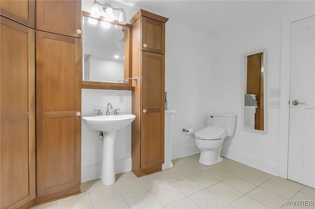 132 Lakefront Blvd Unit 403, Buffalo, NY 14202 - bathroom featuring toilet, tile patterned flooring, and baseboards