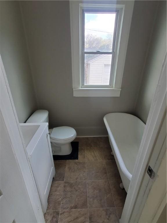 21 Manitou St, Rochester, NY 14621 - full bath featuring a freestanding tub, toilet, and baseboards