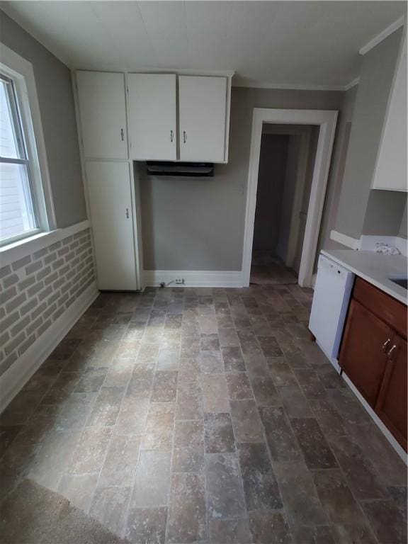 21 Manitou St, Rochester, NY 14621 - kitchen with white cabinetry, light countertops, brick patterned flooring, baseboards, and ornamental molding