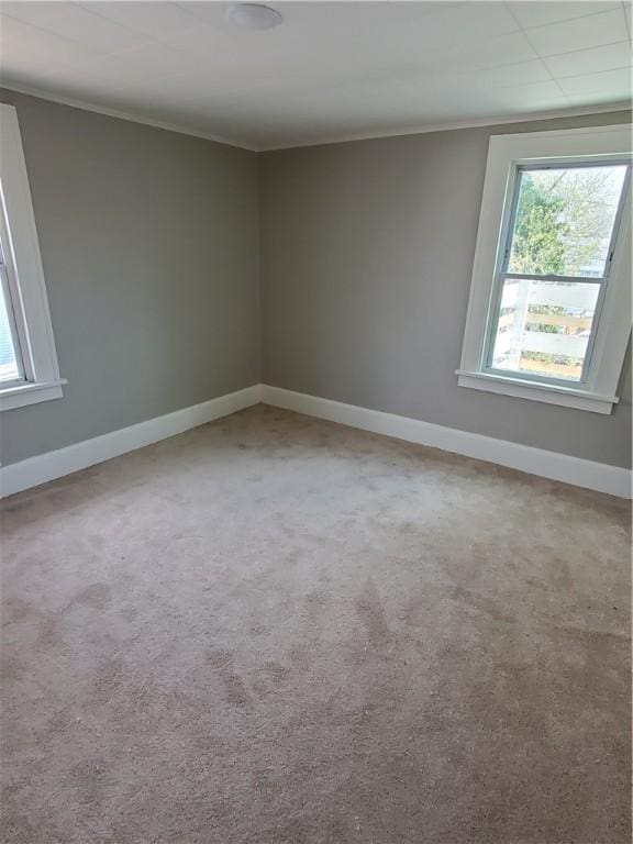 21 Manitou St, Rochester, NY 14621 - carpeted empty room featuring crown molding and baseboards