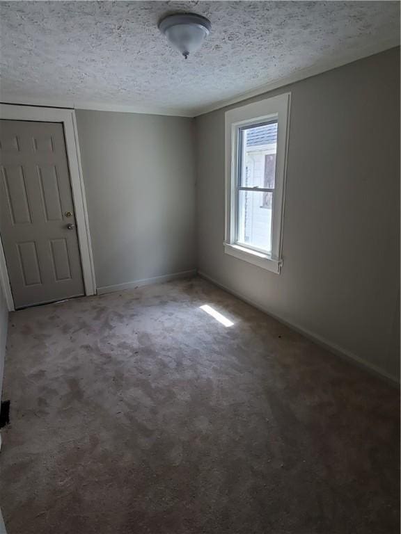 21 Manitou St, Rochester, NY 14621 - unfurnished room featuring baseboards, a textured ceiling, and carpet