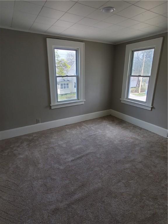 21 Manitou St, Rochester, NY 14621 - carpeted spare room with baseboards