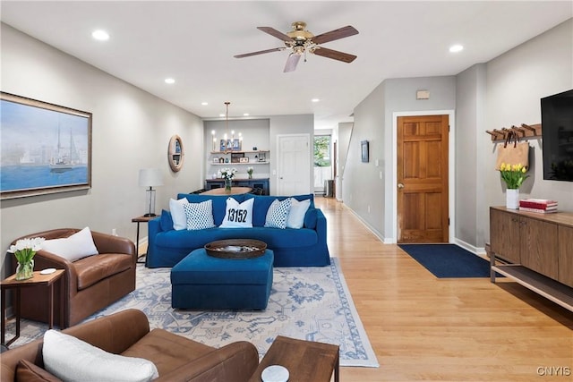 18 E Genesee St Unit 1, Skaneateles, NY 13152 - living area featuring light wood-type flooring, baseboards, ceiling fan, and recessed lighting