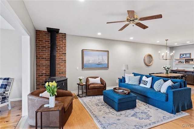 18 E Genesee St Unit 1, Skaneateles, NY 13152 - living area featuring a wood stove, light wood-style flooring, recessed lighting, baseboards, and ceiling fan