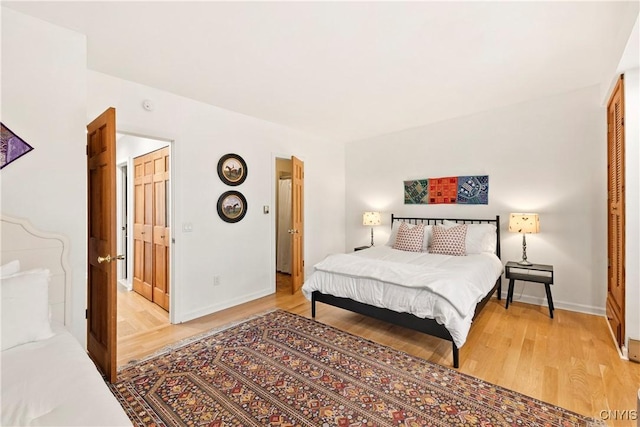 18 E Genesee St Unit 1, Skaneateles, NY 13152 - bedroom featuring light wood-style floors and baseboards