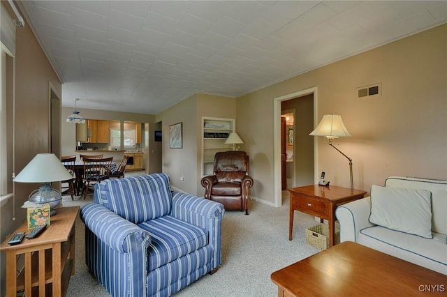 47388 Dingman Point Rd, Alexandria, NY 13607 - living room featuring light carpet, baseboards, and crown molding
