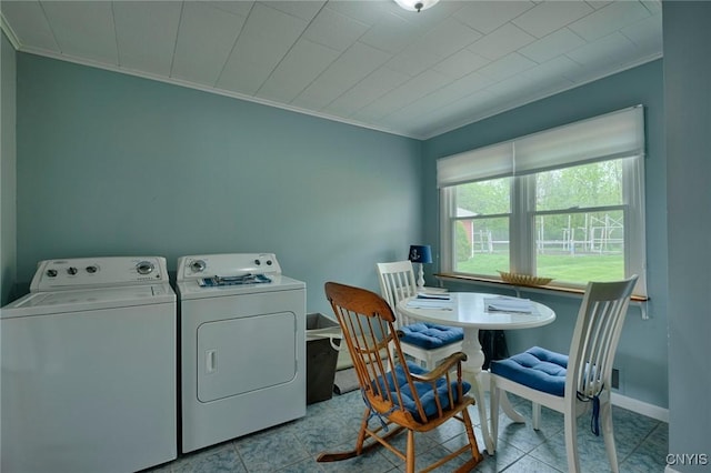 47388 Dingman Point Rd, Alexandria, NY 13607 - laundry area with ornamental molding, washer and clothes dryer, baseboards, and tile patterned floors