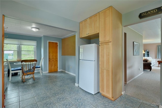 47388 Dingman Point Rd, Alexandria, NY 13607 - kitchen featuring freestanding refrigerator, light brown cabinets, baseboards, crown molding, and tile patterned floors