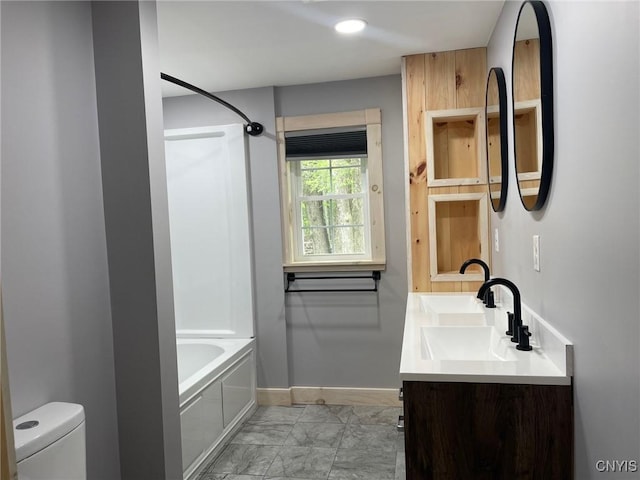 4456 Palmer Rd, Annsville, NY 13471 - full bath featuring toilet, baseboards, double vanity, washtub / shower combination, and marble finish floors