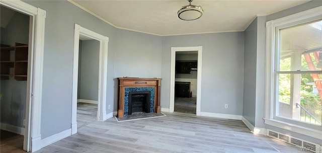 317 Portage Rd, Niagara Falls, NY 14303 - unfurnished living room with a premium fireplace, crown molding, healthy amount of natural light, baseboards, and wood finished floors