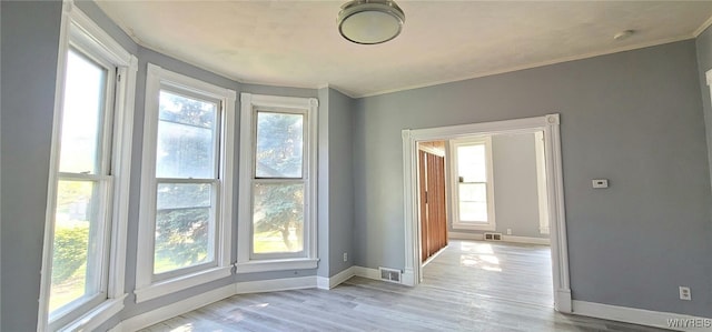 317 Portage Rd, Niagara Falls, NY 14303 - unfurnished room featuring baseboards, crown molding, and light wood-style flooring