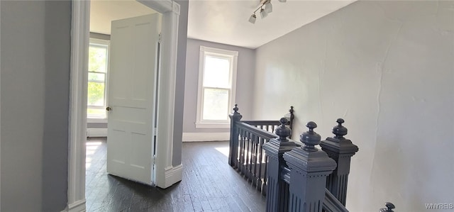 317 Portage Rd, Niagara Falls, NY 14303 - corridor featuring an upstairs landing, baseboards, hardwood / wood-style flooring, and track lighting