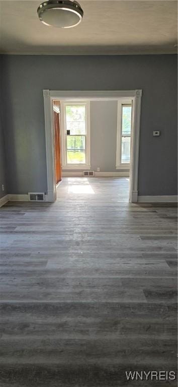 317 Portage Rd, Niagara Falls, NY 14303 - empty room featuring wood finished floors, baseboards, and crown molding