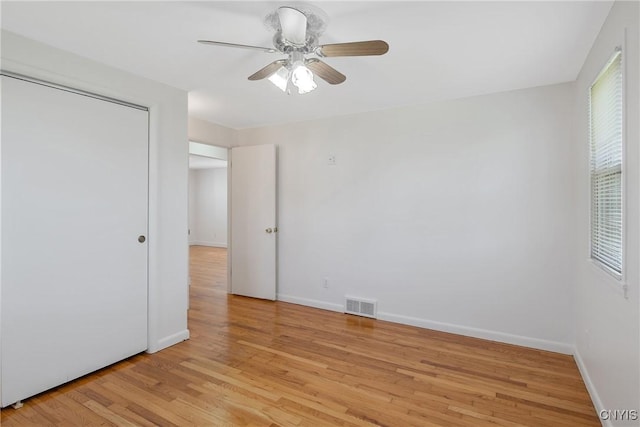 103 Pulaski St, Syracuse, NY 13204 - unfurnished bedroom with light wood-style floors, baseboards, and ceiling fan