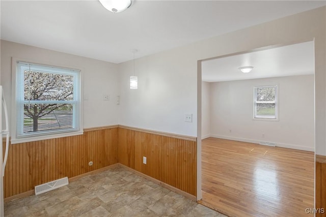 103 Pulaski St, Syracuse, NY 13204 - empty room with wainscoting and wood walls