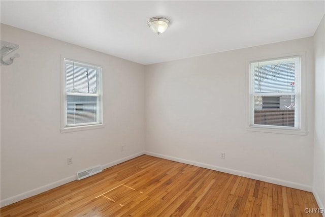 103 Pulaski St, Syracuse, NY 13204 - unfurnished room featuring baseboards and light wood-style floors