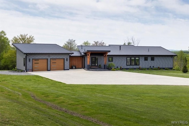 7317 Concord Rd, Concord, NY 14141 - view of front of house with a standing seam roof, an attached garage, concrete driveway, a front yard, and metal roof
