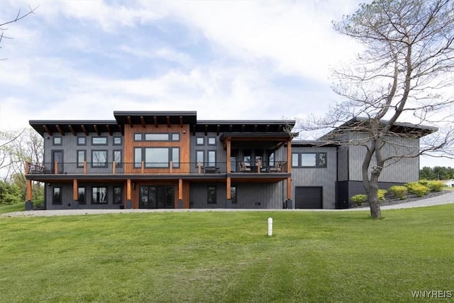 7317 Concord Rd, Concord, NY 14141 - rear view of house with a lawn, a garage, and a balcony
