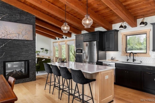 7317 Concord Rd, Concord, NY 14141 - kitchen featuring a sink, stainless steel appliances, healthy amount of natural light, dark cabinetry, and wood ceiling