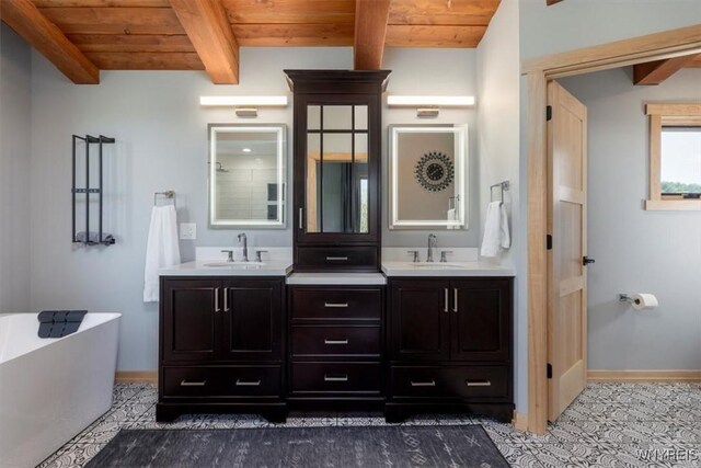 7317 Concord Rd, Concord, NY 14141 - full bathroom with wooden ceiling with exposed beams, a freestanding tub, baseboards, and double vanity