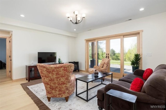 7317 Concord Rd, Concord, NY 14141 - living room featuring french doors, light wood finished floors, recessed lighting, a chandelier, and baseboards