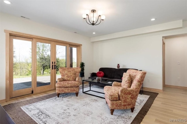 7317 Concord Rd, Concord, NY 14141 - living area featuring light wood finished floors, recessed lighting, a chandelier, and baseboards