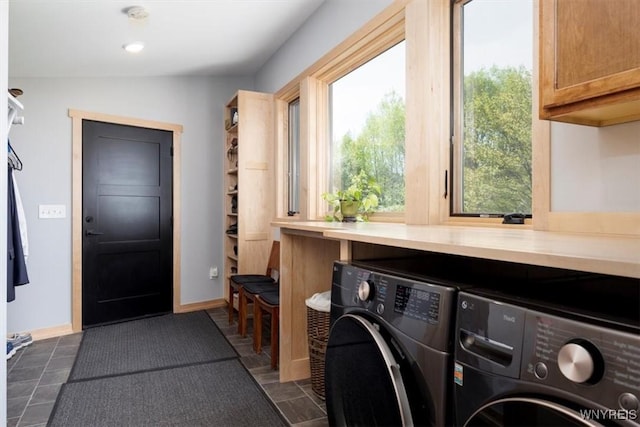 7317 Concord Rd, Concord, NY 14141 - washroom with washing machine and clothes dryer, cabinet space, and baseboards