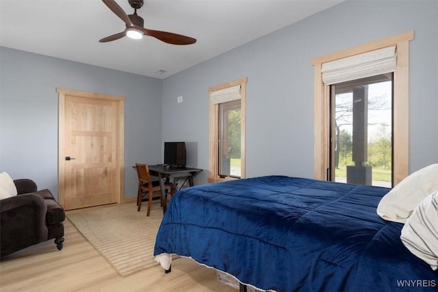 7317 Concord Rd, Concord, NY 14141 - bedroom featuring access to exterior, wood finished floors, multiple windows, and ceiling fan