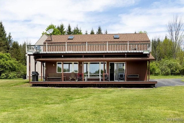 7317 Concord Rd, Concord, NY 14141 - back of house featuring a lawn, a wooden deck, and roof with shingles