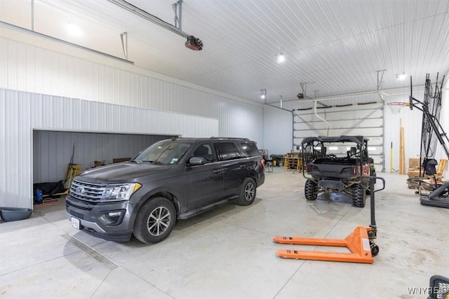 7317 Concord Rd, Concord, NY 14141 - garage featuring a garage door opener